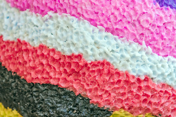 Close up to beautiful of various rough textures and colors of candles. Texture multicolor background. Selective focus.