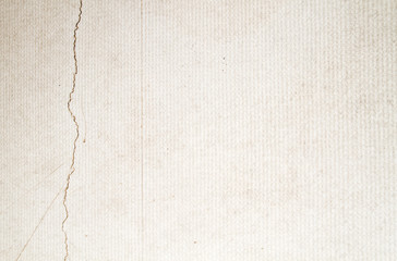 Old cracked wall with wallpaper