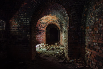 Fototapeta premium Dark corridor in old abandoned German fortification