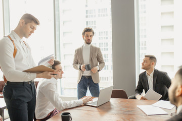 people hold conference at office. Business executive delivering presentation to colleagues or business partners during meeting or in-house business training, explaining business plans