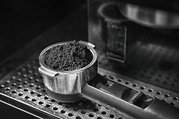 capacity filled with ground coffee on trellised plane, espresso, breakfast, barista, monochrome