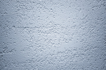 Wall plastered with putty bark beetle, background for design, gray wall with decorative plaster
