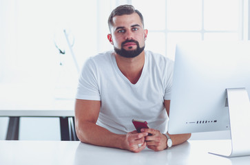 Businessman in the office on the phone with headset, Skype