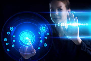 Fototapeta premium Business, Technology, Internet and network concept. Young businessman working on a virtual screen of the future and sees the inscription: Contact us