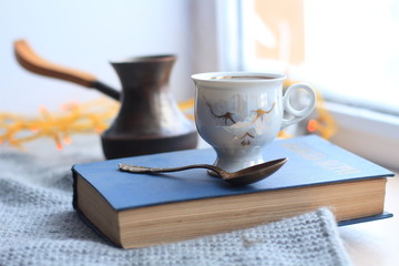 Winter still-life of tea and book