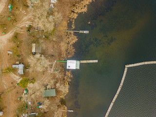 Aerial drone view. Fishing pier on the river.