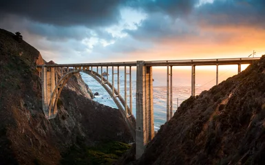 Wandcirkels aluminium Bixby-brug langs Highway 1 bij zonsondergang, Big Sur, Californië, VS © JFL Photography