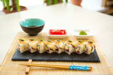 Sushi rolls on black slate surface. Japanese food