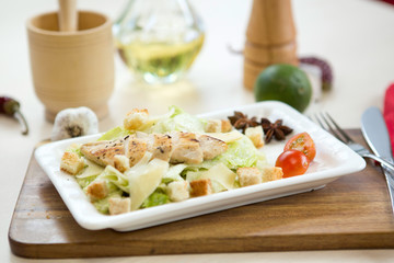Homemade Vegetable salad with chicken and cheese on table