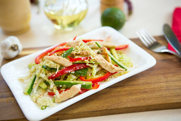 Homemade Vegetable salad on a plate on wooden cutting board Healthy and tasty food.