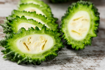 slices of raw karela on a table
