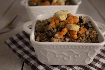 Buckwheat porridge with meat, side view, close-up. Russian national dish