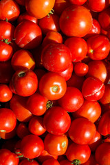 red tomatoes on a market stall
