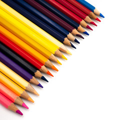 Colored pencils placed on a white background