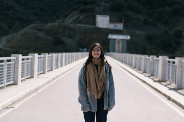 beautiful woman smiling on a lonely road