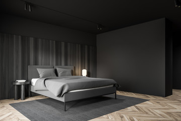 Minimalistic gray and wooden bedroom corner