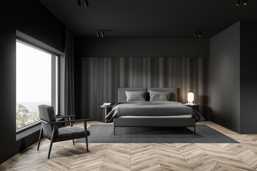 Gray and wooden bedroom interior with armchair