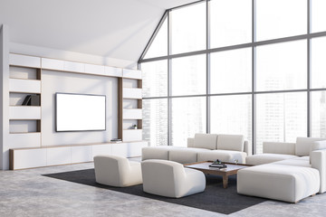 White living room corner with TV and sofa