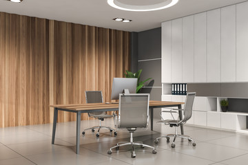 White and wooden CEO office corner