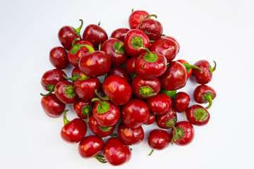 Round chili peppers on a white background
