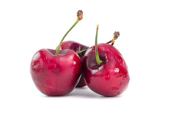 Isolated fresh red cherry on white background with clipping path.