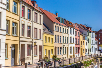 Fototapeta na wymiar Colorful houses at the canal in Wismar, Germany