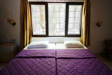 beautiful bedroom and daylight coming through the window