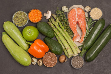 Set of healthy food, salmon, vegetables, beans, nuts, quinoa, bulgur, chickpeas, flax, almond. Sources of omega 3.