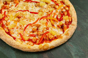 Fresh and tasty italian pizza on wooden background