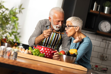 Elderly man in love cooks for his sweetheart