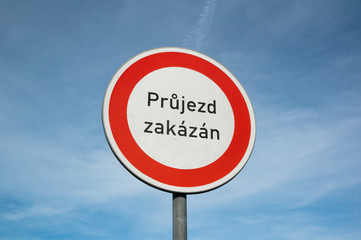 Traffic sign with text (translation from Czech: No trespassing) - roadsign to stop, cease and halt.