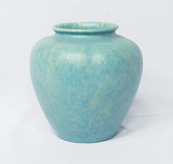 A vintage antique ceramic fragile pottery royal lancastrian 1916 blue and aqua vase isolated on a white background. old pottery pots from the past, found in junk shops and thrift stores. - obrazy, fototapety, plakaty