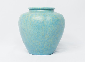 A vintage antique ceramic fragile pottery royal lancastrian 1916 blue and aqua vase isolated on a white background. old pottery pots from the past, found in junk shops and thrift stores. - obrazy, fototapety, plakaty