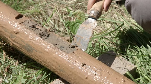 Geologist preparing drill pipe to take core samples for geological survey