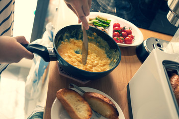 Cooking breakfast on kitchen counter bar in morning