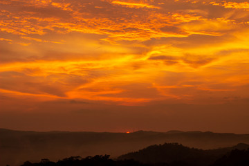Obraz premium The sunset on Purba Volcano Mountain,Mount Api Purba. one of the tourist destination in Gunungkidul, Yogyakarta, Indonesia.