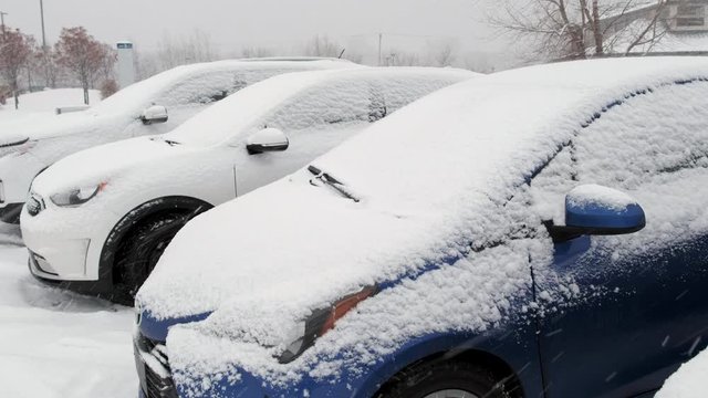 Cars Covered by Snow in Parking during Snow Storm. 4K