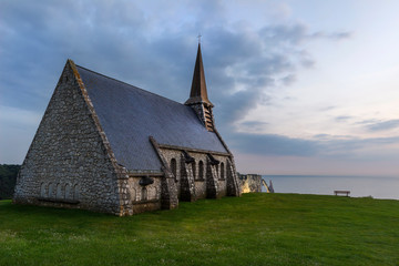 Notre Dame de la Garde church at sunset in Etretat, Normandy, France.