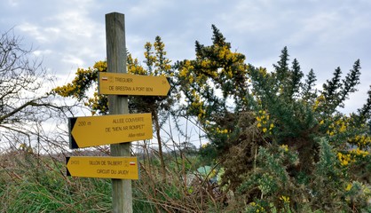 direction signs for hikers on a path in Brittany. France