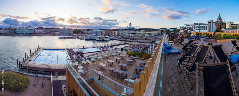 Wall mural helsinki. finland. panorama of the waterfront of helsinki. outdoor swimming pool in finland. seating