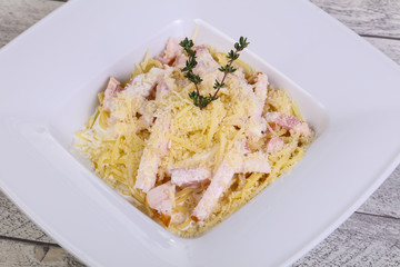 Pasta carbonara with ham and cheese