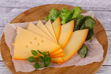 Sliced yellow Swiss cheese