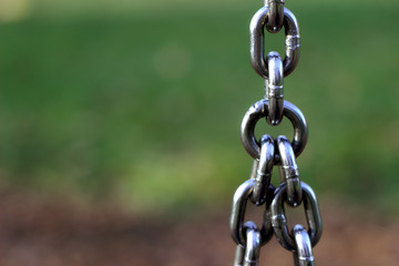 Swing chain on a playground shows cohesion and team spirit