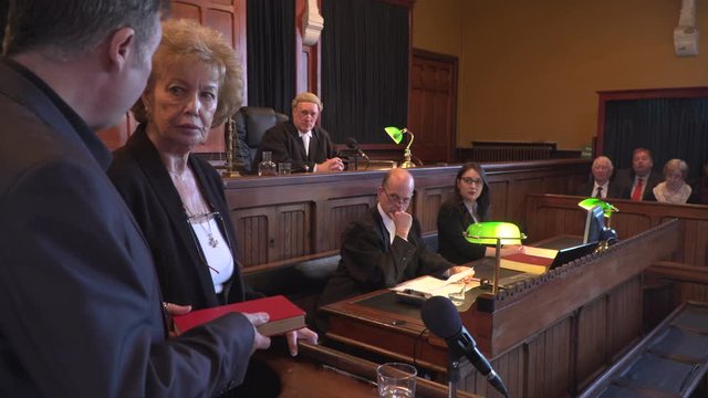 4K: Witness taking oath in Court hearing - Court case with Judge & Lawyer / Barrister. Set in a Court house or Court Room