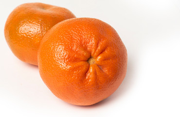 Fresh ripe orange mandarin on the white background.