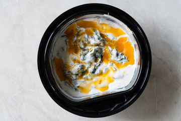 Take Away Healthy Turkish Food Spinach Borani with Yogurt / Yogurt and Red Oil Sauce.