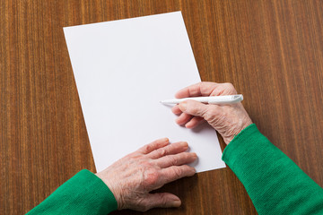 Old hands with blank paper