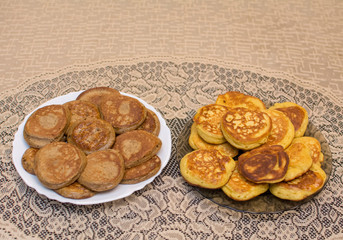 Pancakes from chickpea and wheat flour are on the plates