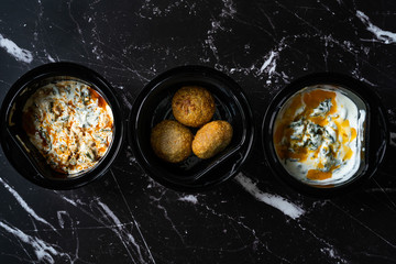 Take Away Heathy Turkish Food Chard, Spinach Borani with Yogurt and  Kibbeh, Stuffed Meatballs Icli Kofte / Kofta in Plastic Container.