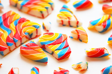 Scattered lollipop explosion. Colorful lollipops swirl. Striped spiral multi colored candy, explosion effect. Destroying fragments